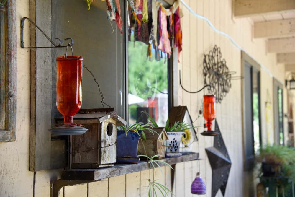 use brackets to hang bird feeders without a tree